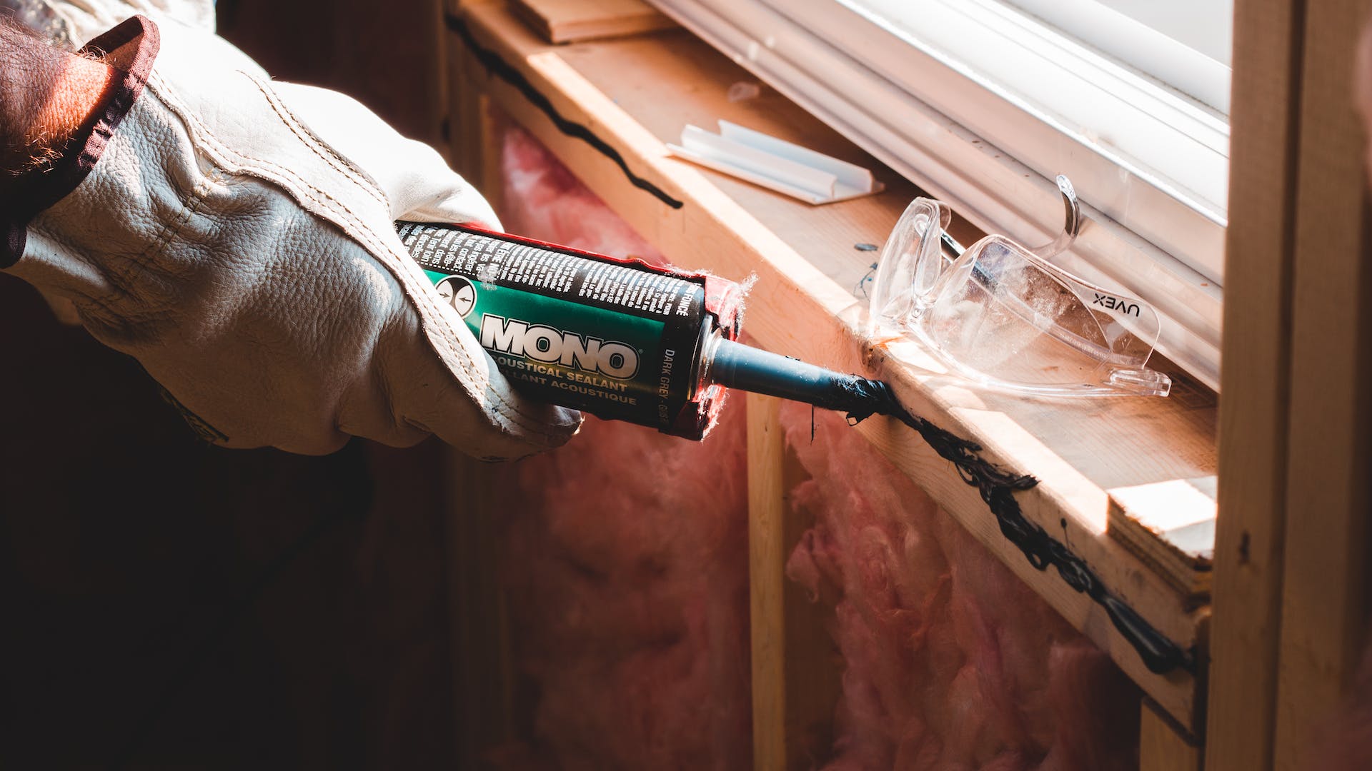 Picture of person caulking by Erik Mclean